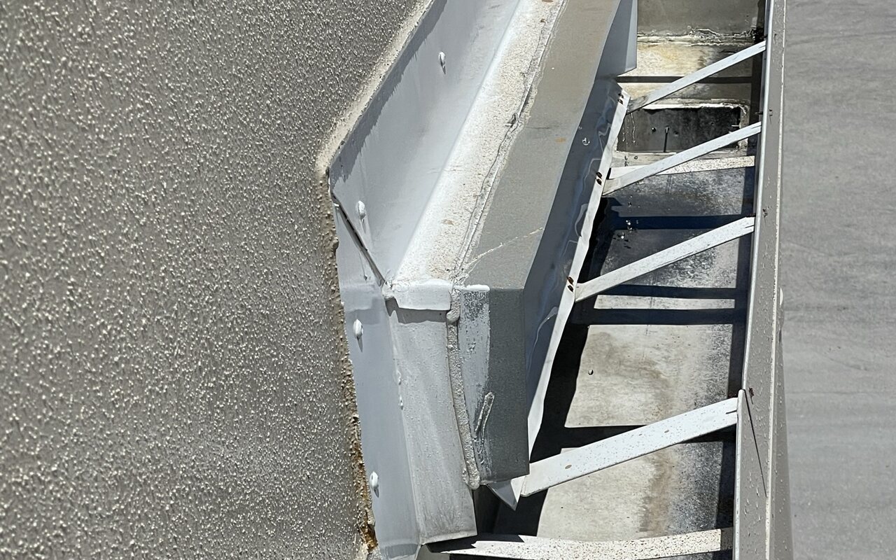 The same commercial roof edge cleaned and resealed