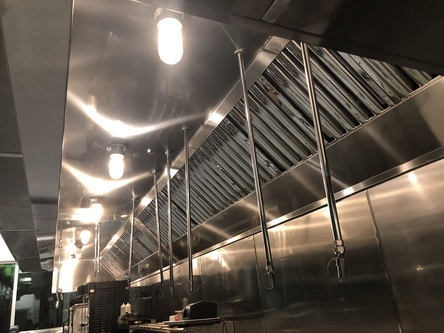 Commercial kitchen hood and exhaust cleaning