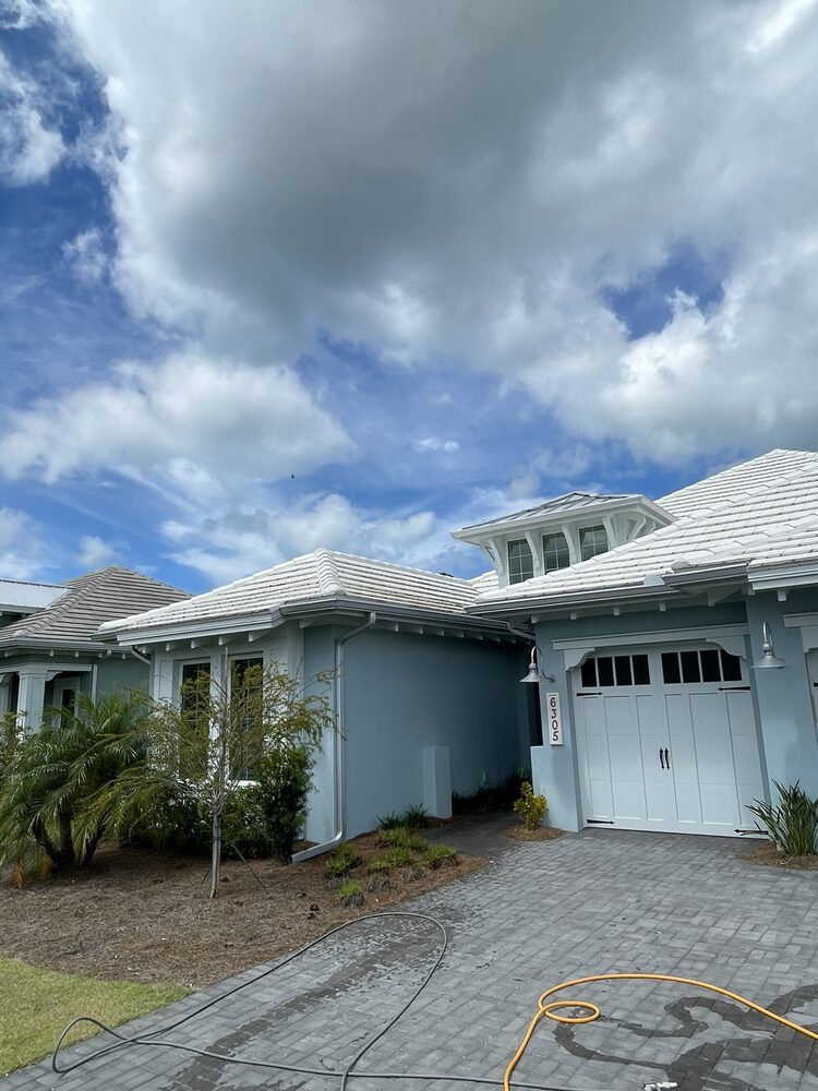 Home with clean paver driveway