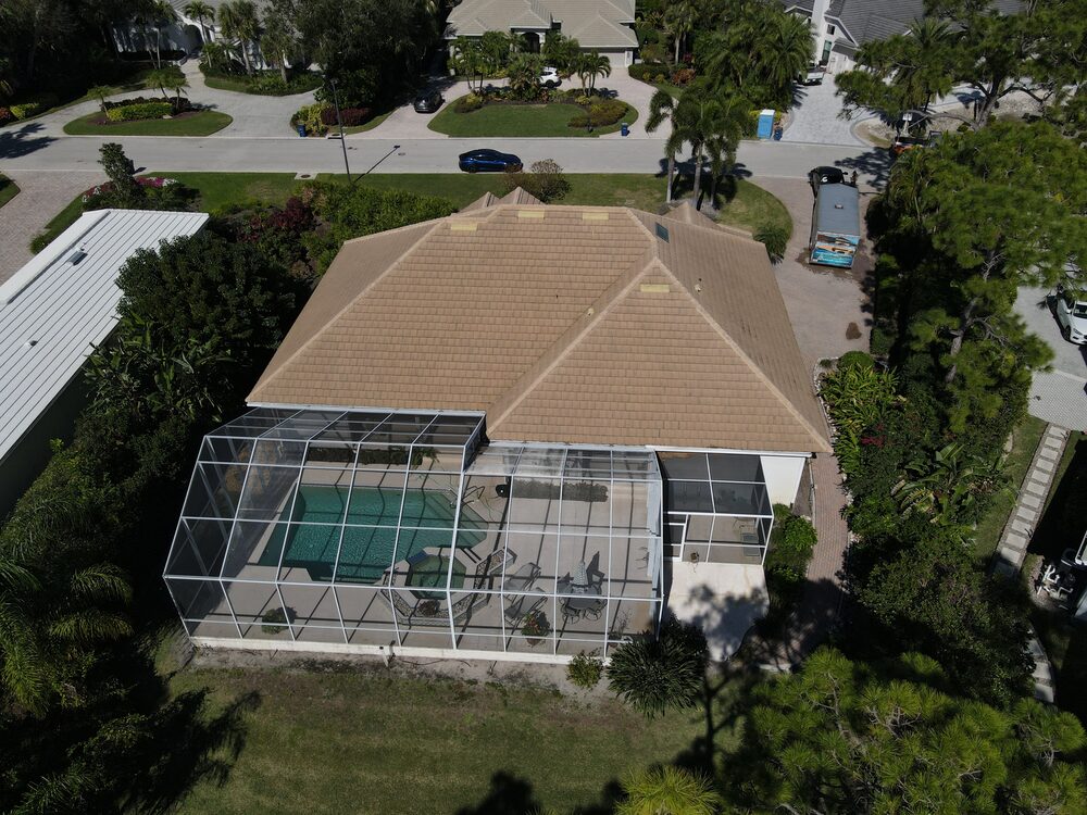 Aerial of a clean home and pool deck