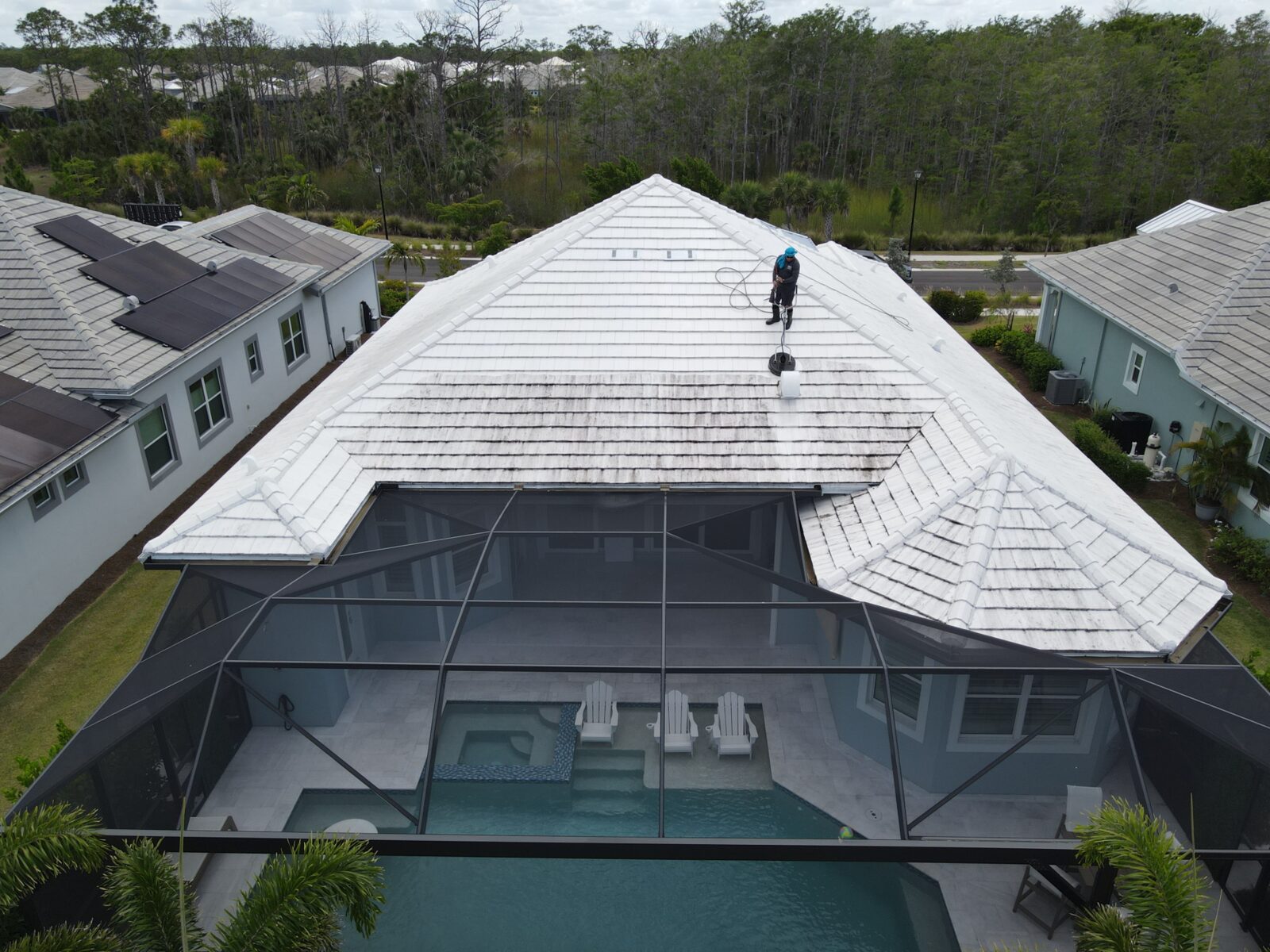 A white roof cleaned with controlled pressure washing